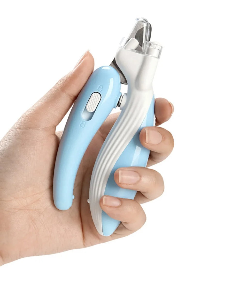Clawvo LED nail clipper held in a hand, showing its size
